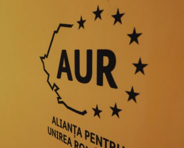 Reacția AUR după ce Bolojan a anunțat că vrea să vândă acțiuni la companiile de stat